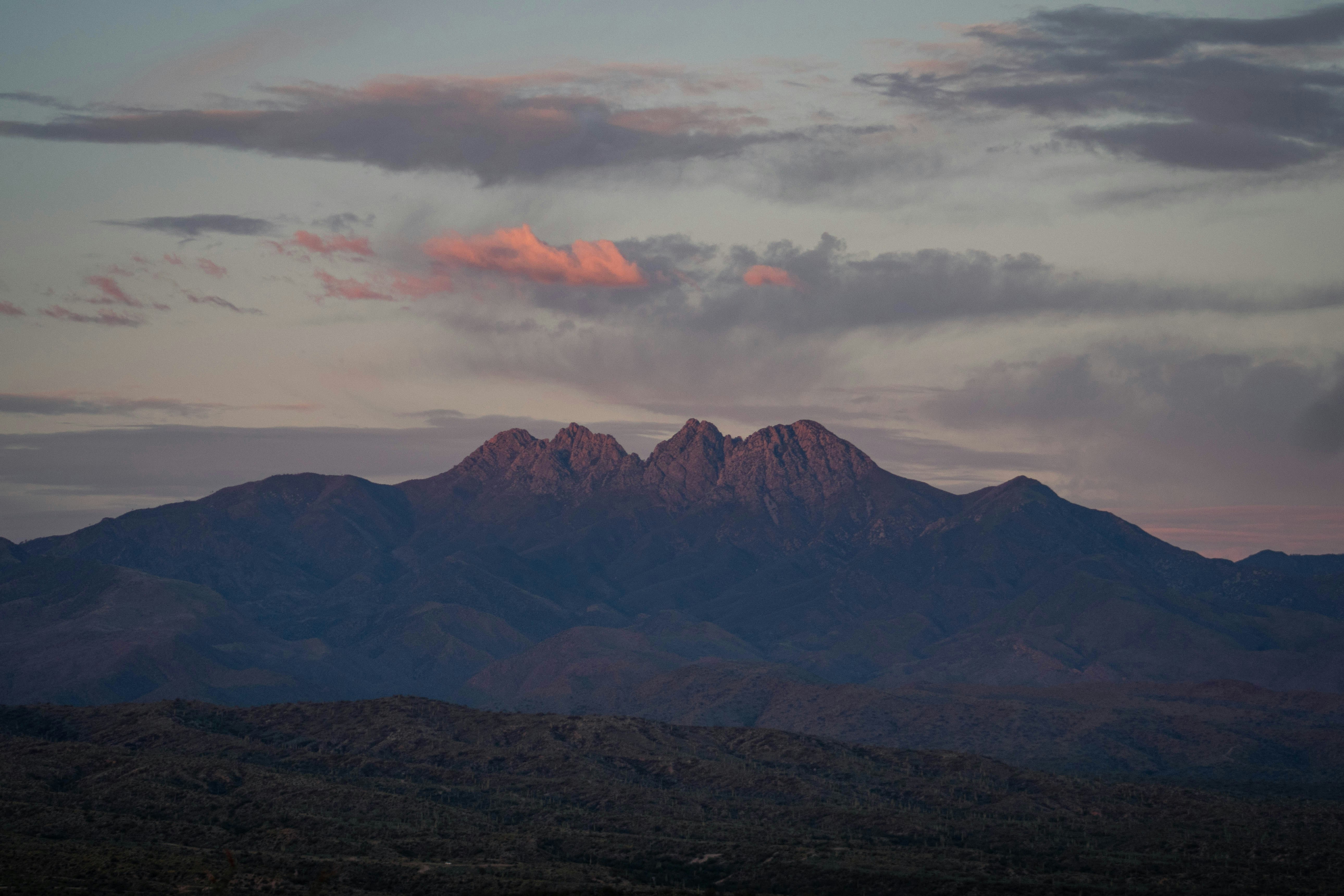 black and white mountains under white clouds